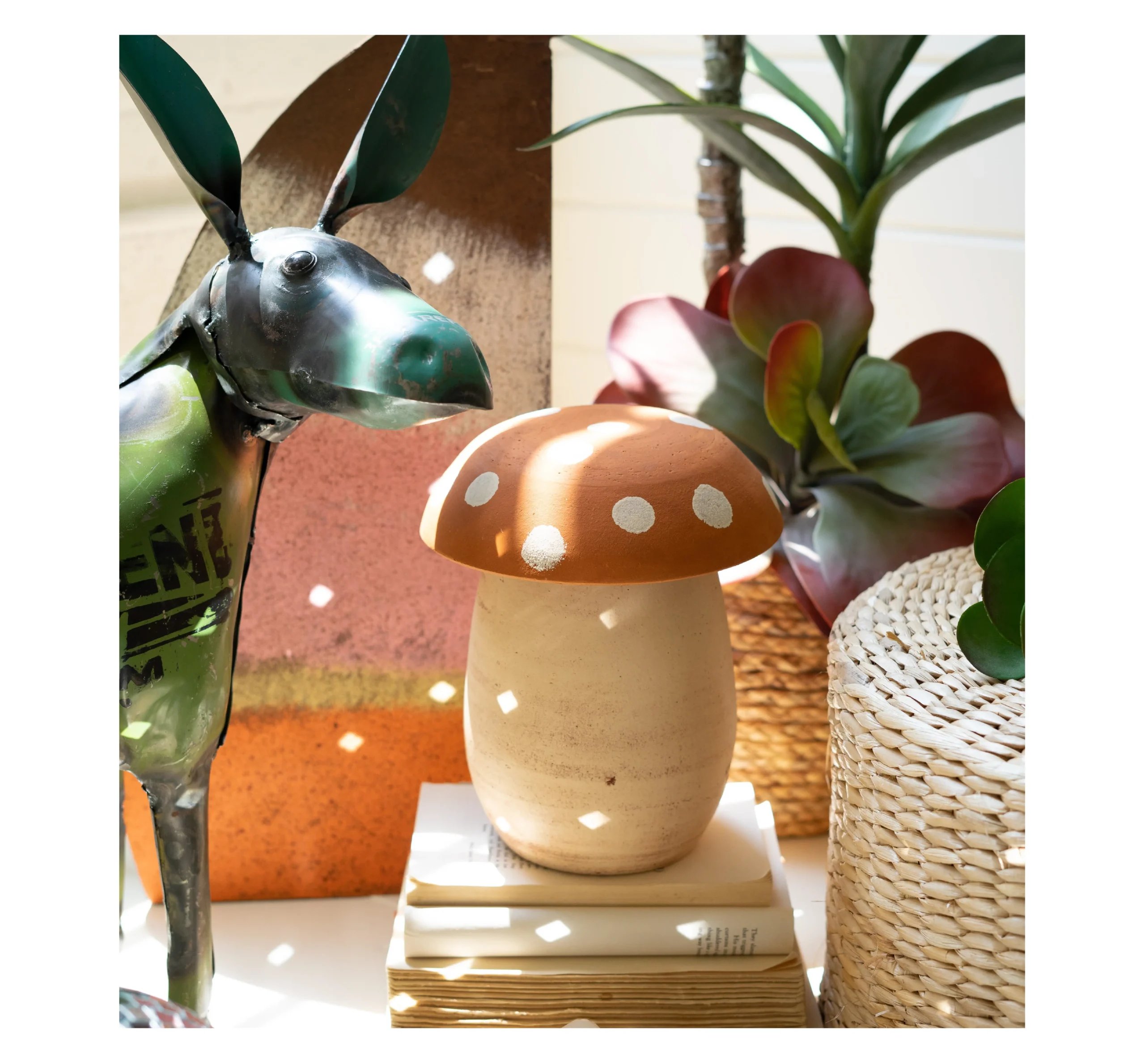 Cottage Core detail with metal donkey and ceramic mushrooms