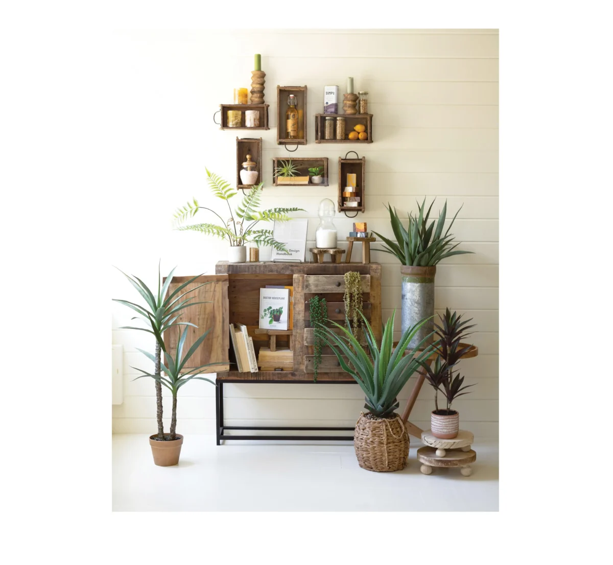 Wooden brick molds with greenery and rustic side table.