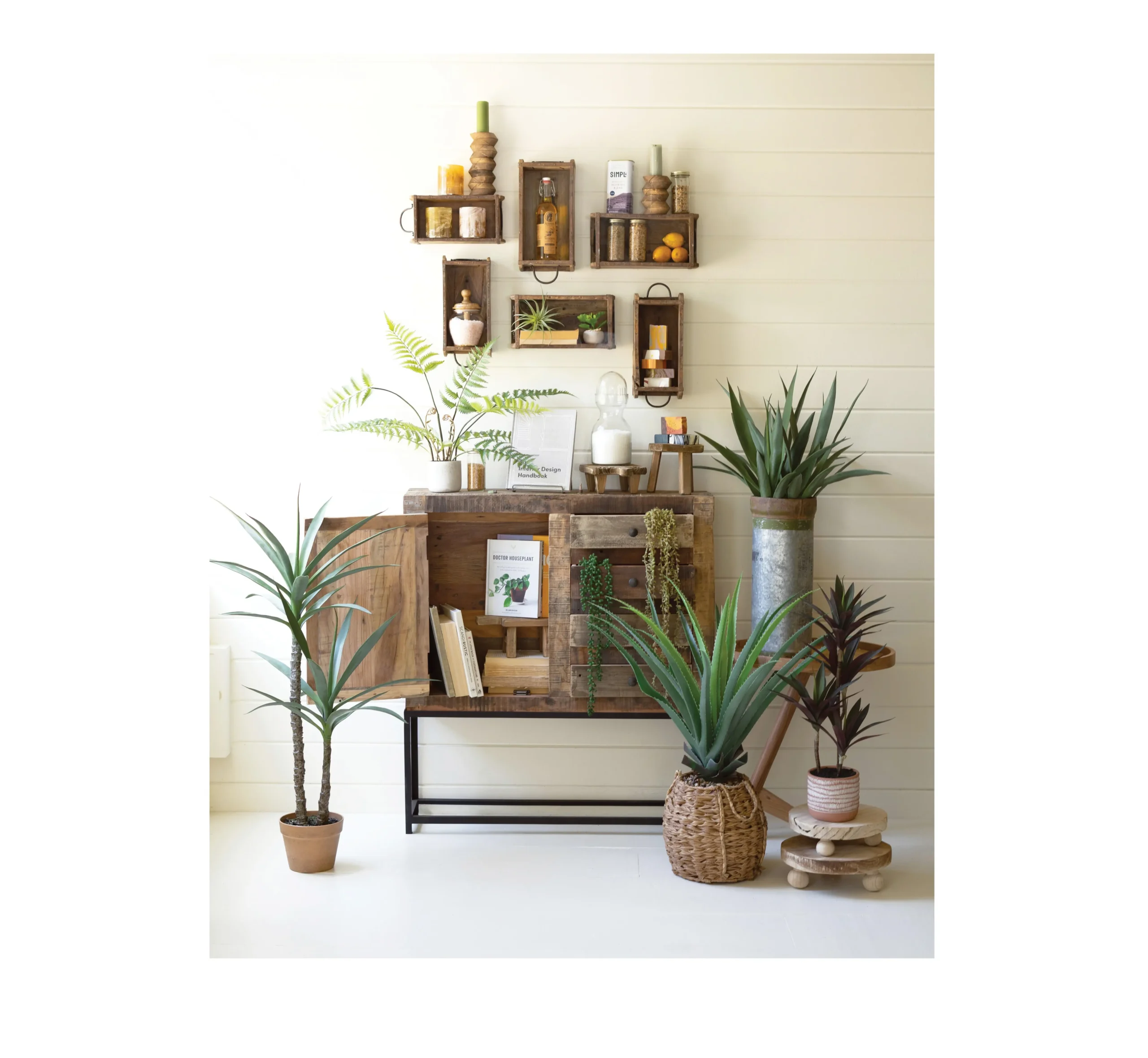 Wooden brick molds with greenery and rustic side table. 